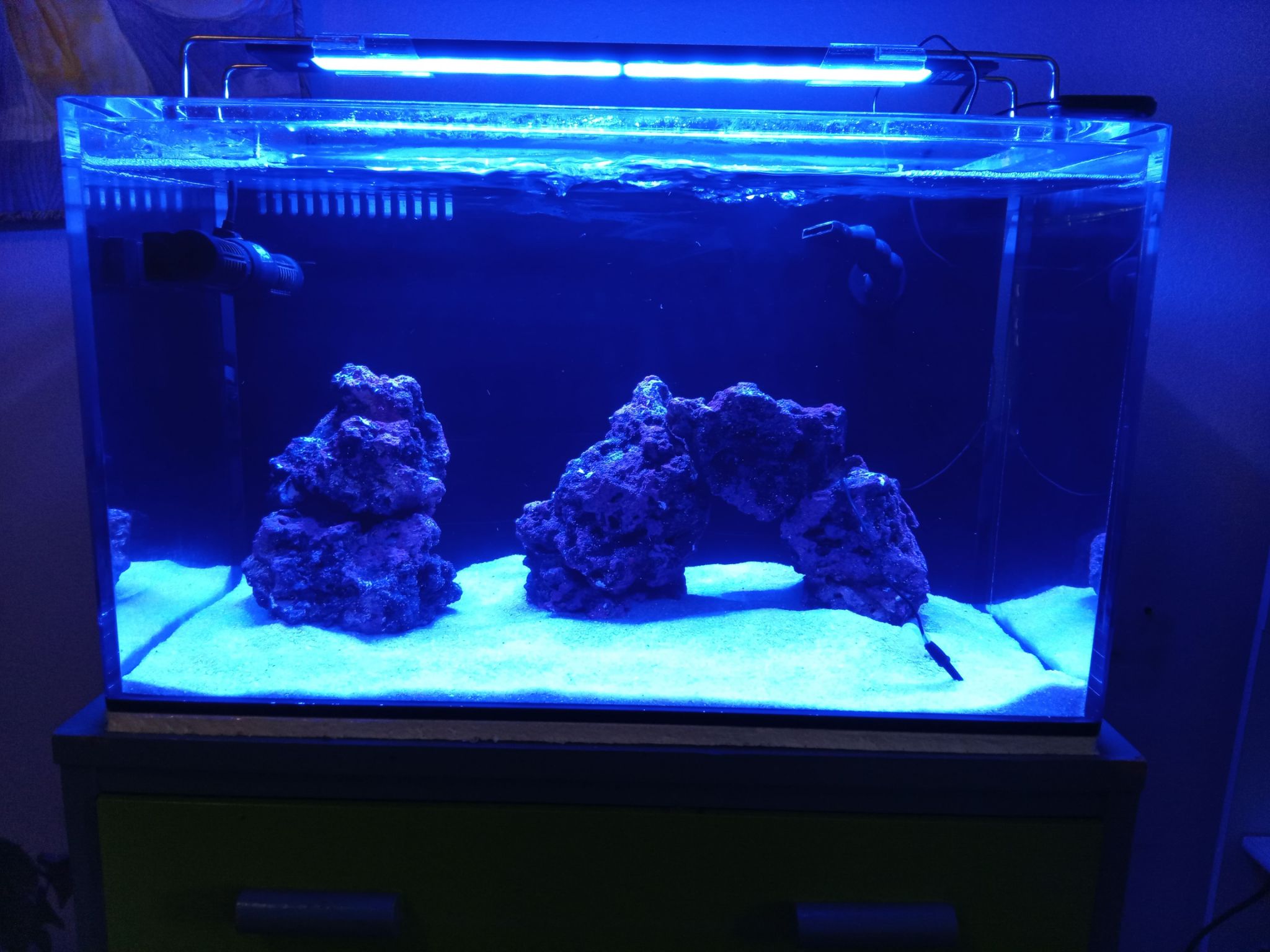 Nano reef tank setup with live rock and sump filtration